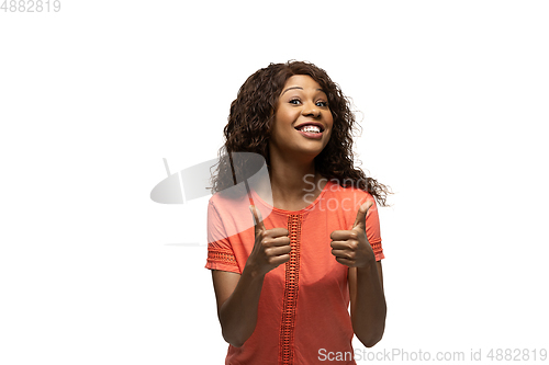 Image of Young african-american woman with funny, unusual popular emotions and gestures isolated on white studio background