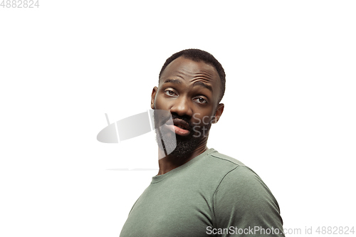 Image of Young african-american man with funny, unusual popular emotions and gestures isolated on white studio background