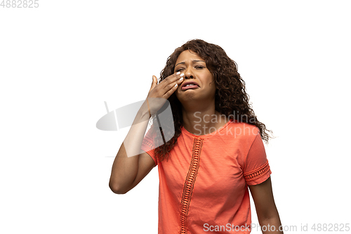 Image of Young african-american woman with funny, unusual popular emotions and gestures isolated on white studio background