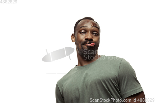 Image of Young african-american man with funny, unusual popular emotions and gestures isolated on white studio background