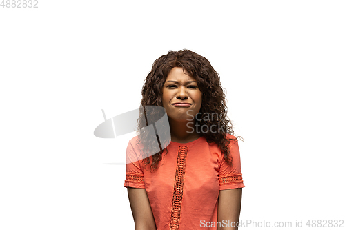 Image of Young african-american woman with funny, unusual popular emotions and gestures isolated on white studio background