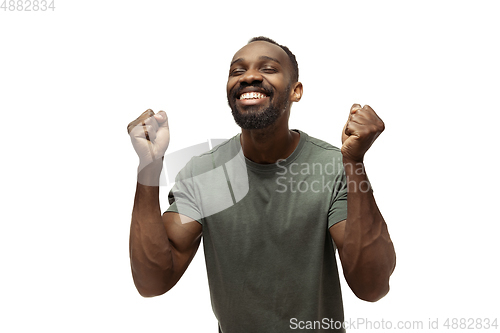 Image of Young african-american man with funny, unusual popular emotions and gestures isolated on white studio background