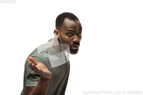 Image of Young african-american man with funny, unusual popular emotions and gestures isolated on white studio background