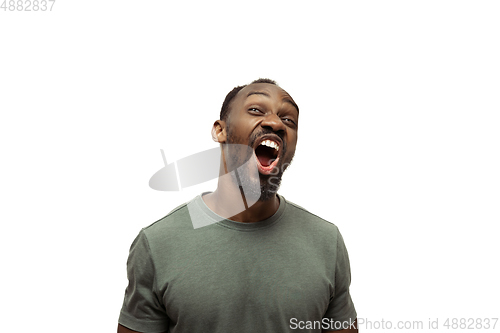 Image of Young african-american man with funny, unusual popular emotions and gestures isolated on white studio background