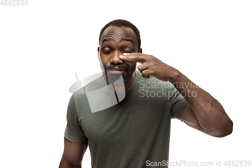 Image of Young african-american man with funny, unusual popular emotions and gestures isolated on white studio background