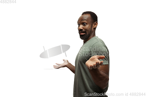 Image of Young african-american man with funny, unusual popular emotions and gestures isolated on white studio background