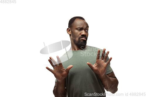 Image of Young african-american man with funny, unusual popular emotions and gestures isolated on white studio background