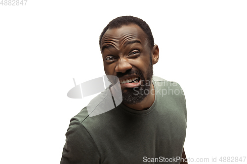 Image of Young african-american man with funny, unusual popular emotions and gestures isolated on white studio background