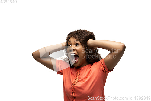 Image of Young african-american woman with funny, unusual popular emotions and gestures isolated on white studio background