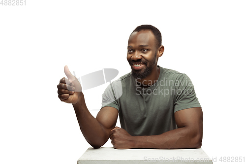 Image of Young african-american man with funny, unusual popular emotions and gestures isolated on white studio background