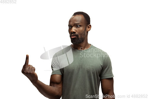 Image of Young african-american man with funny, unusual popular emotions and gestures isolated on white studio background