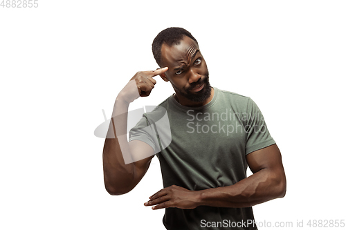 Image of Young african-american man with funny, unusual popular emotions and gestures isolated on white studio background