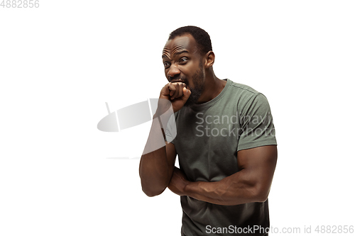 Image of Young african-american man with funny, unusual popular emotions and gestures isolated on white studio background