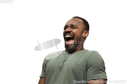 Image of Young african-american man with funny, unusual popular emotions and gestures isolated on white studio background