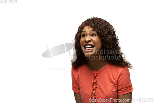 Image of Young african-american woman with funny, unusual popular emotions and gestures isolated on white studio background