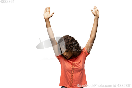 Image of Young african-american woman with funny, unusual popular emotions and gestures isolated on white studio background