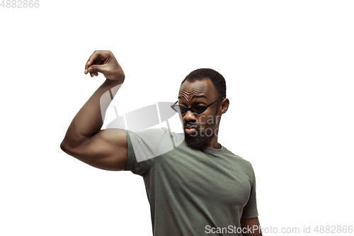 Image of Young african-american man with funny, unusual popular emotions and gestures isolated on white studio background