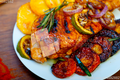 Image of roasted grilled BBQ chicken breast with herbs and spices