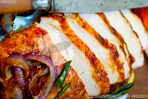 Image of roasted grilled BBQ chicken breast with herbs and spices