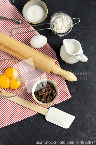 Image of rolling pin, milk, eggs, flour and chocolate