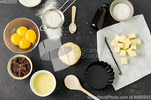 Image of dough, baking dish and cooking ingredients