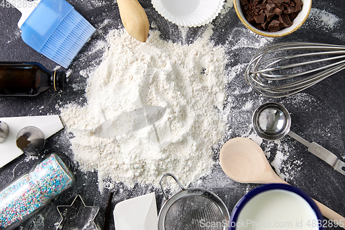 Image of flour with baking and cooking ingredients on table