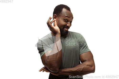 Image of Young african-american man with funny, unusual popular emotions and gestures isolated on white studio background