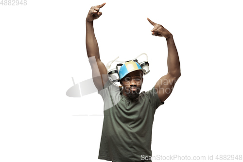 Image of Young african-american man with funny, unusual popular emotions and gestures isolated on white studio background