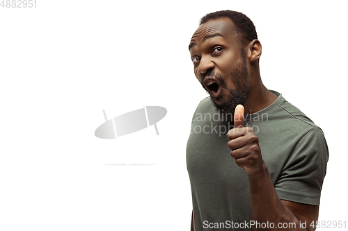 Image of Young african-american man with funny, unusual popular emotions and gestures isolated on white studio background