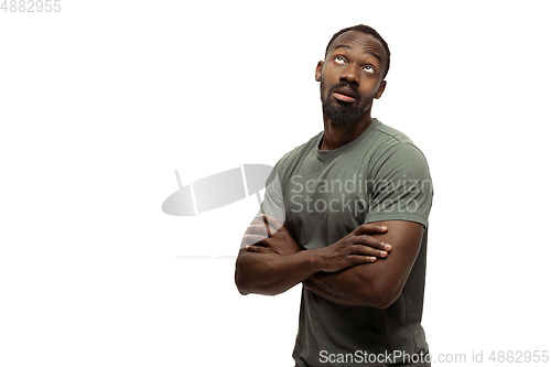 Image of Young african-american man with funny, unusual popular emotions and gestures isolated on white studio background