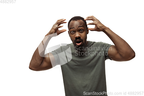 Image of Young african-american man with funny, unusual popular emotions and gestures isolated on white studio background