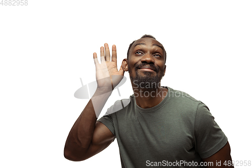 Image of Young african-american man with funny, unusual popular emotions and gestures isolated on white studio background