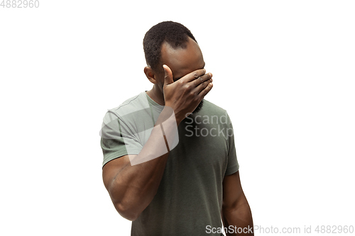 Image of Young african-american man with funny, unusual popular emotions and gestures isolated on white studio background