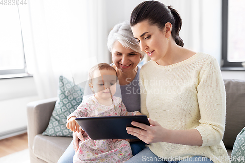 Image of mother, daughter and grandma with tablet pc