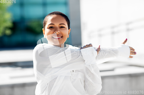 Image of african american woman doing sports outdoors