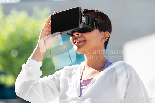 Image of happy african american woman with vr glasses