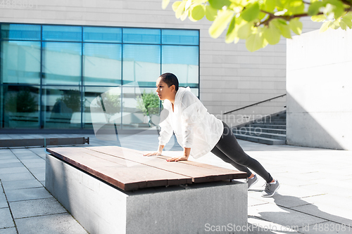 Image of african american woman doing sports outdoors