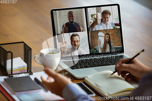 Image of Remote meeting. Man working from home during coronavirus or COVID-19 quarantine, remote office concept.