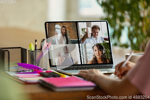 Image of Remote meeting. Woman working from home during coronavirus or COVID-19 quarantine, remote office concept.