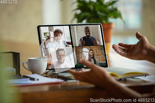 Image of Remote meeting. Man working from home during coronavirus or COVID-19 quarantine, remote office concept.