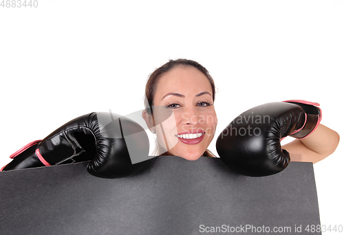 Image of Woman with boxing gloves looking smiling