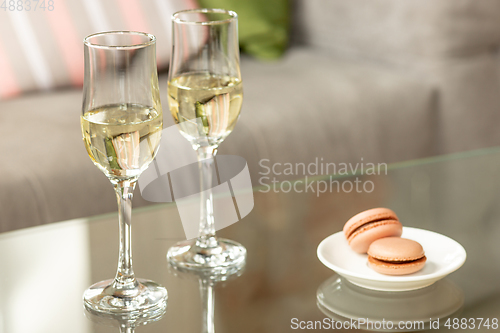 Image of Glasses of sparkling champagne, close up. Warm colored. Celebration event, holidays, drinks concept