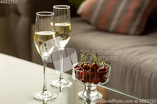 Image of Glasses of sparkling champagne, close up. Warm colored. Celebration event, holidays, drinks concept