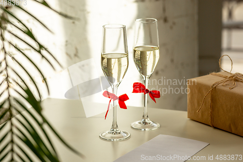 Image of Glasses of sparkling champagne, close up. Warm colored. Celebration event, holidays, drinks concept