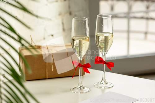 Image of Glasses of sparkling champagne, close up. Warm colored. Celebration event, holidays, drinks concept