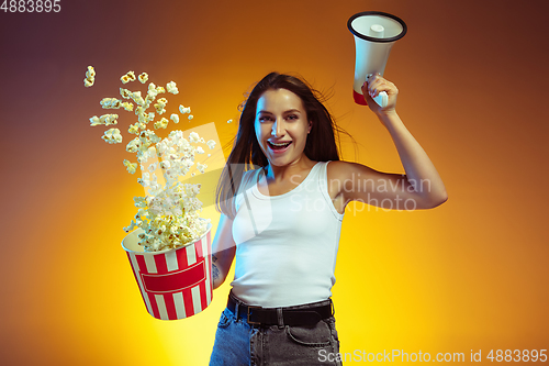 Image of Portrait of young caucasian woman isolated on gradient yellow studio background