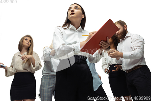 Image of Nervous tensioned investors analyzing crisis stock market with charts on screen of their gadgets