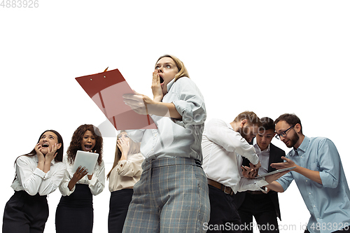 Image of Nervous tensioned investors analyzing crisis stock market with charts on screen of their gadgets