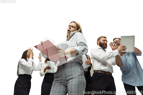 Image of Nervous tensioned investors analyzing crisis stock market with charts on screen of their gadgets