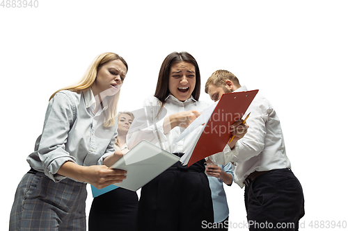 Image of Nervous tensioned investors analyzing crisis stock market with charts on screen of their gadgets